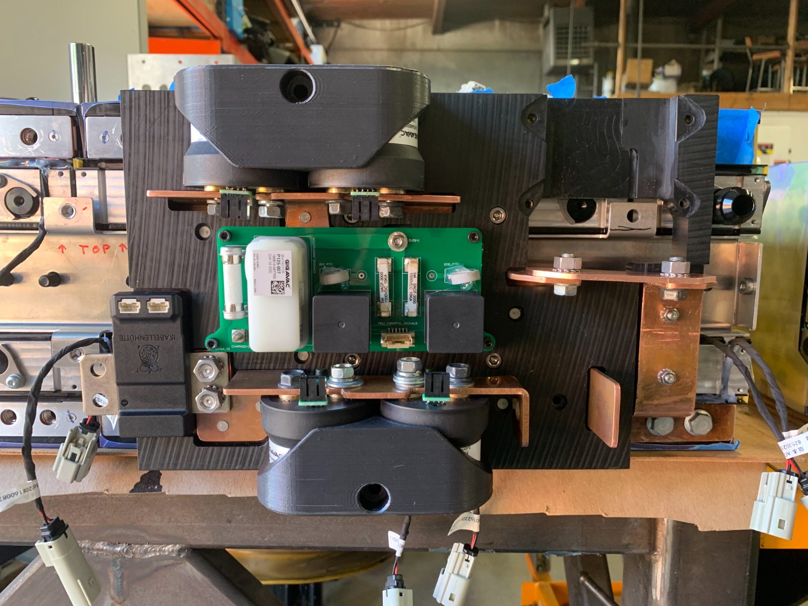 Ariel Nomad Power Distribution Unit - high-voltage contactors, copper bus bars, precharge PCB, and current monitoring on a carbon-fiber panel
